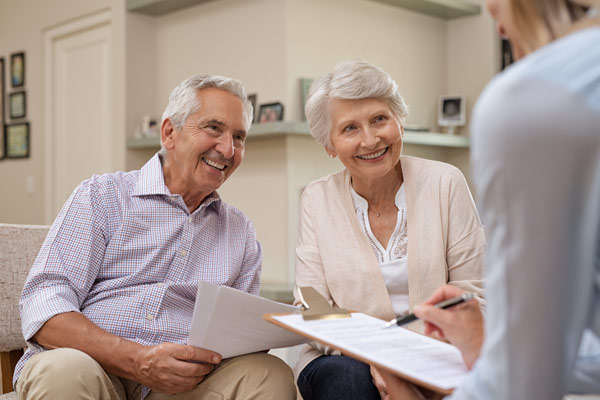 older couple with advisor image, estate planning
